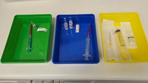 Three different coloured trays